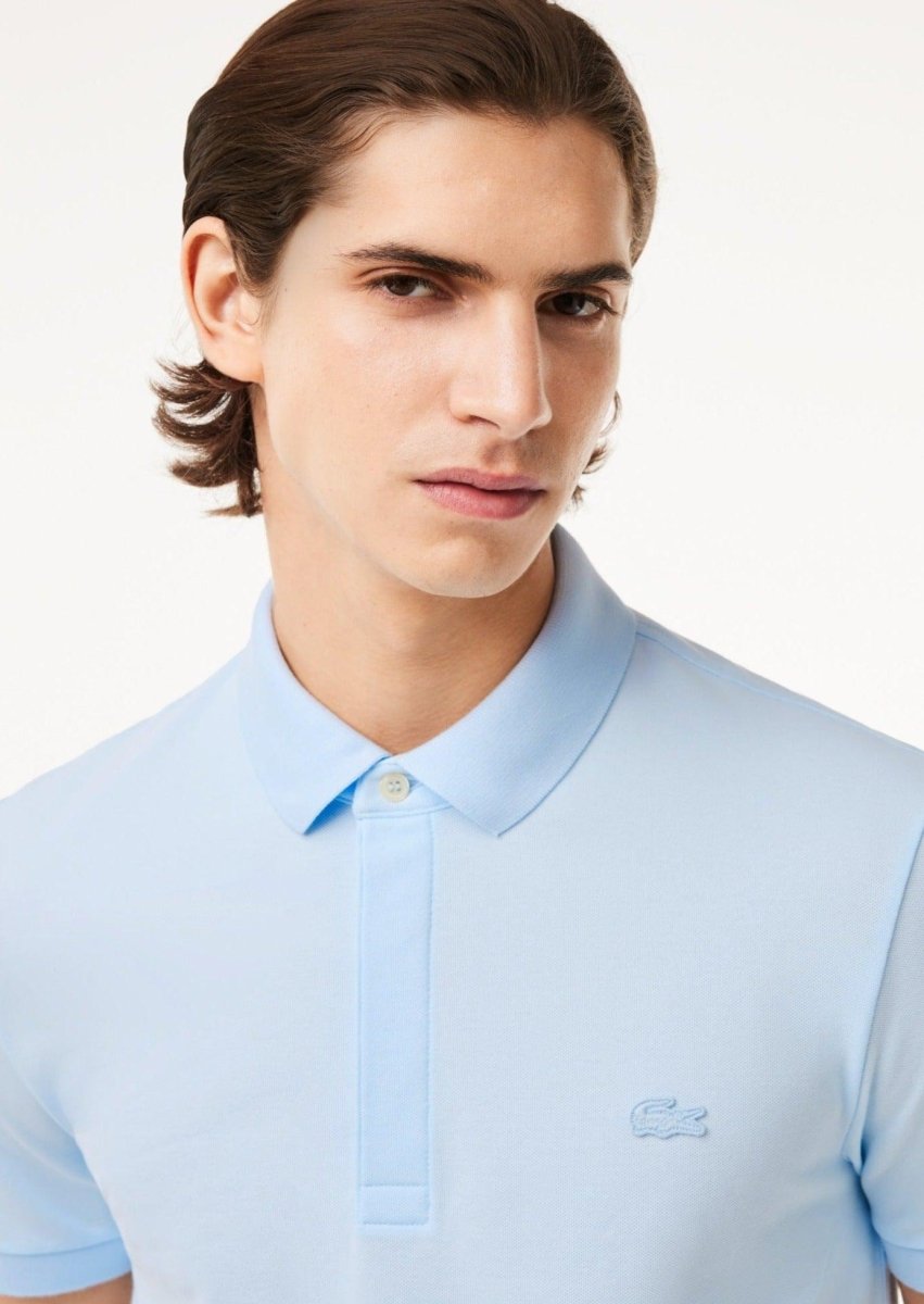 Polo Paris Lacoste bleu clair - French Destock