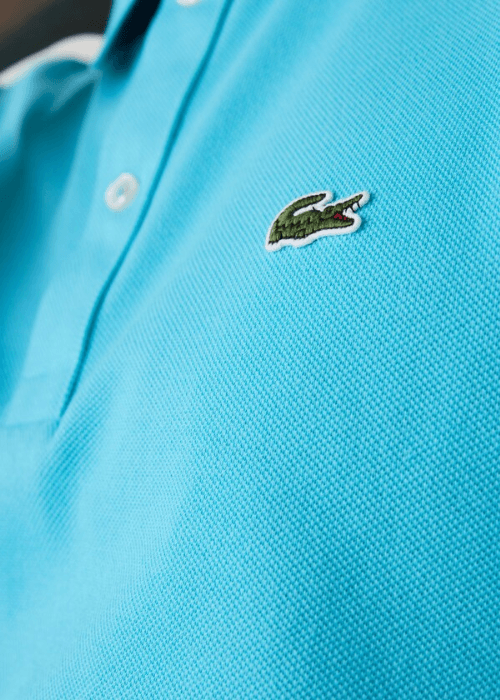 Polo Lacoste bleu - French Destock