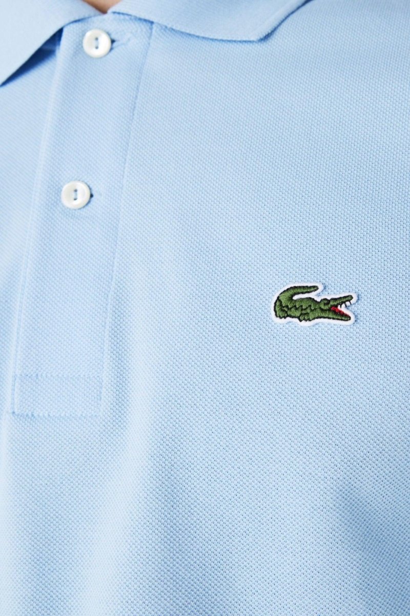 Polo manches longues Lacoste bleu - French Destock