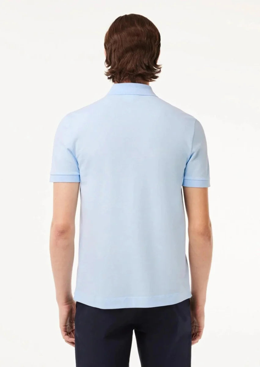 Polo Paris Lacoste bleu clair - French Destock